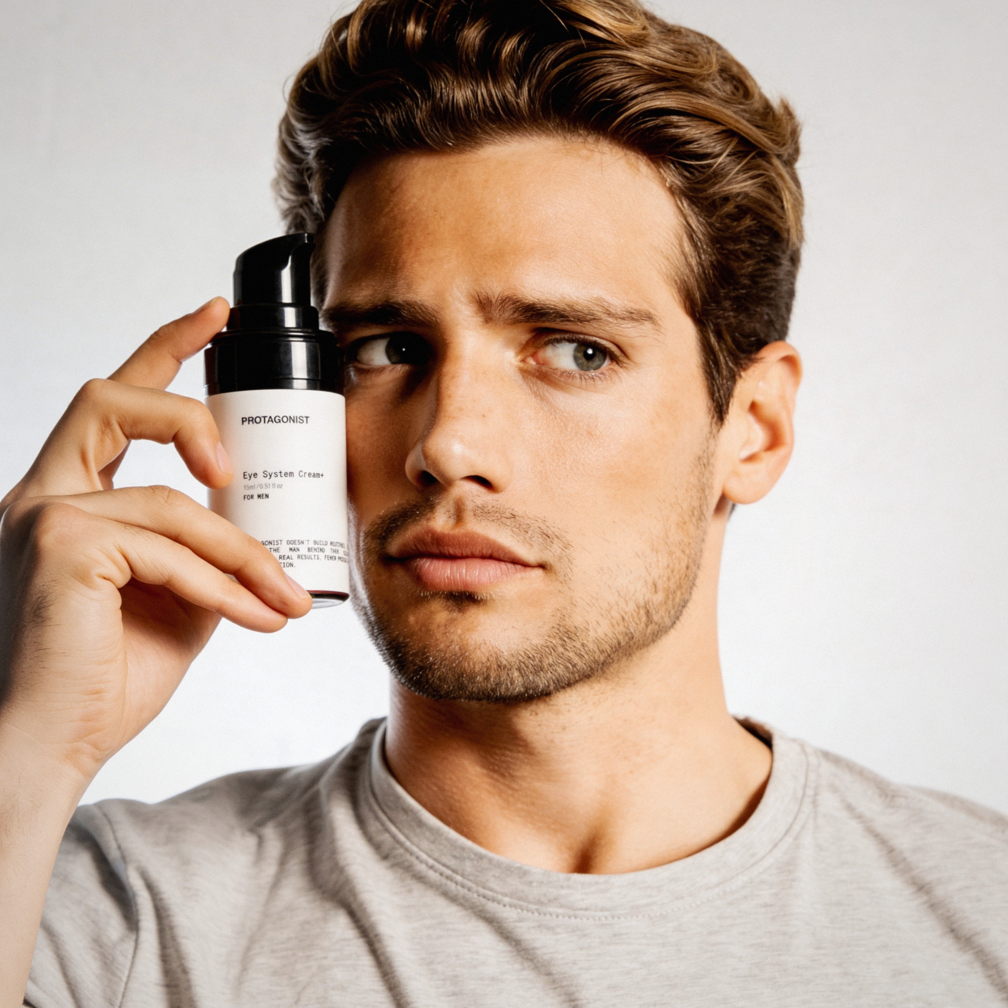 protagonist men hold eye system cream 
